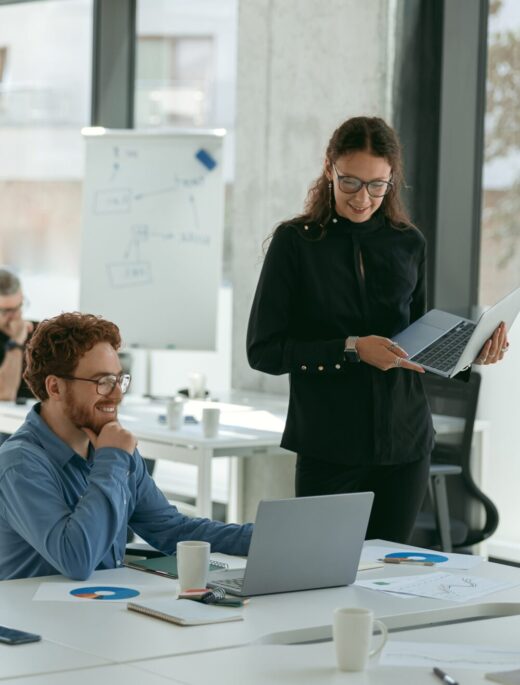 business-people-working-with-laptops-office-colleagues-background-teamwork-concept 1